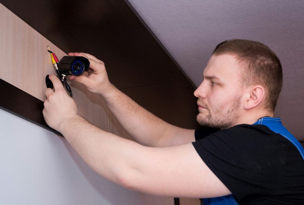 qualified CCTV engineer carrying out CCTV maintenance